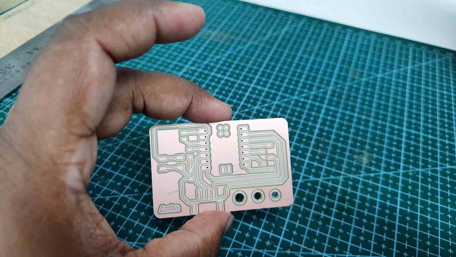PCB board before assembling with holes cleared using a thumb pin
